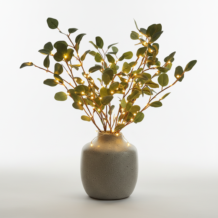 Battery-operated LED olive branch creates a warm white glow, enhancing any room's ambiance and style.