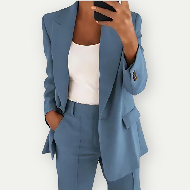 Modern women's power suit, a sophisticated blazer & trouser set, perfect for a strong business aesthetic.