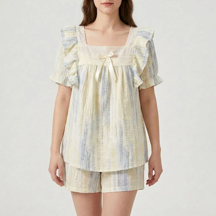 Two-piece women's lace trim nightwear set, featuring a relaxed fit top and matching shorts.