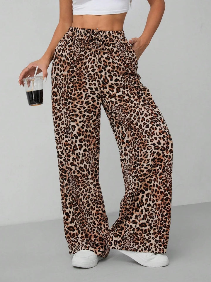 Women's leopard print wide leg pants with drawstring waist. Casual, chic, and comfortable for summer fashion.