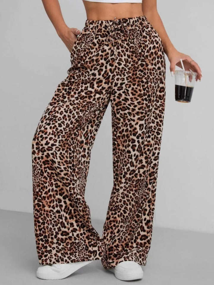 Stylish patterned women's wide leg pants, featuring a trendy leopard print and relaxed, comfortable fit.