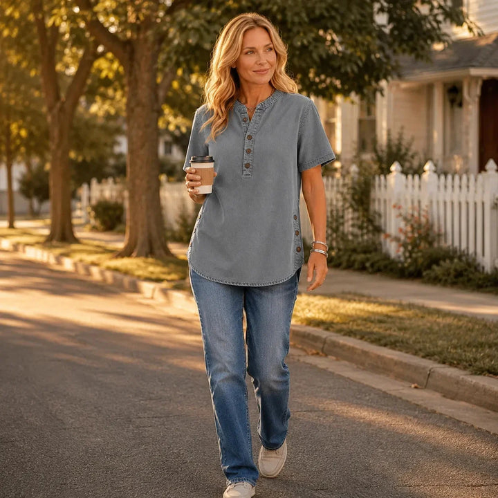 Stylish short sleeve women's tunic top featuring Henley neckline & decorative side buttons.