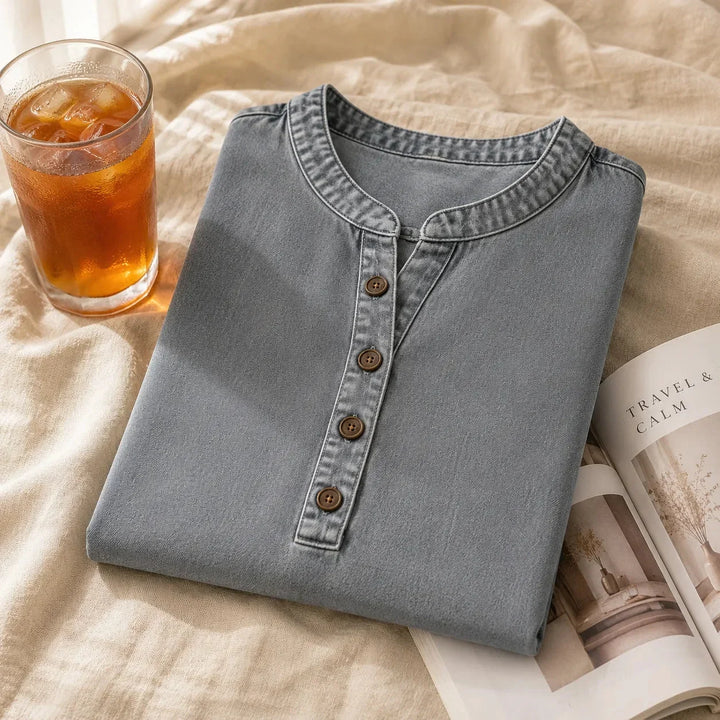 Navy blue women's Henley tunic top, short sleeve, relaxed fit, with fashionable side buttons.