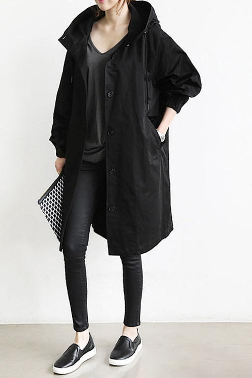 Hooded women's waterproof trench coat, ideal rain jacket with elegant design for fall & spring outerwear.