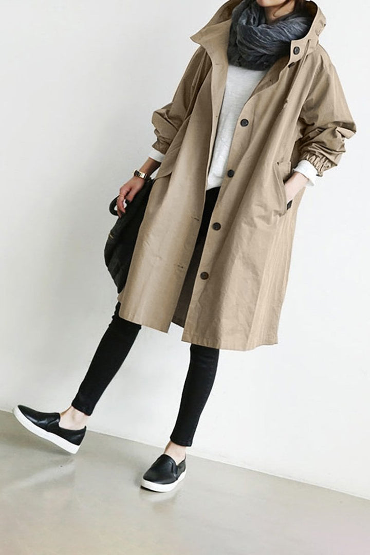 Stylish women's hooded waterproof trench coat, elegant fall & spring outerwear, perfect all-weather rain jacket.