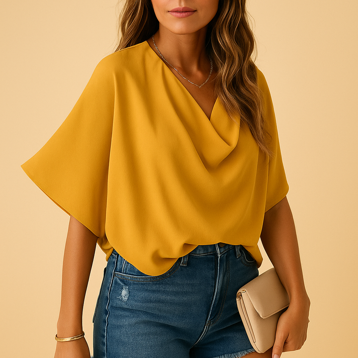 Relaxed fit women's batwing blouse, an elegant long sleeve top for versatile everyday style.