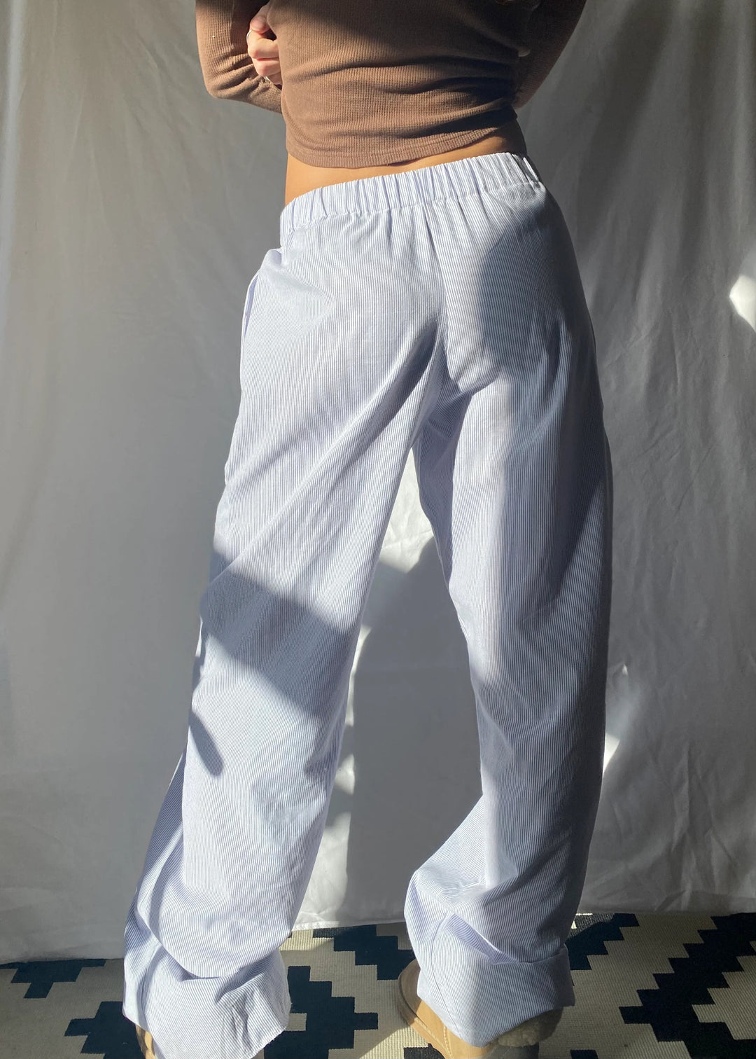 Close-up of practical deep pockets on women's relaxed fit lounge pants, designed for convenience.