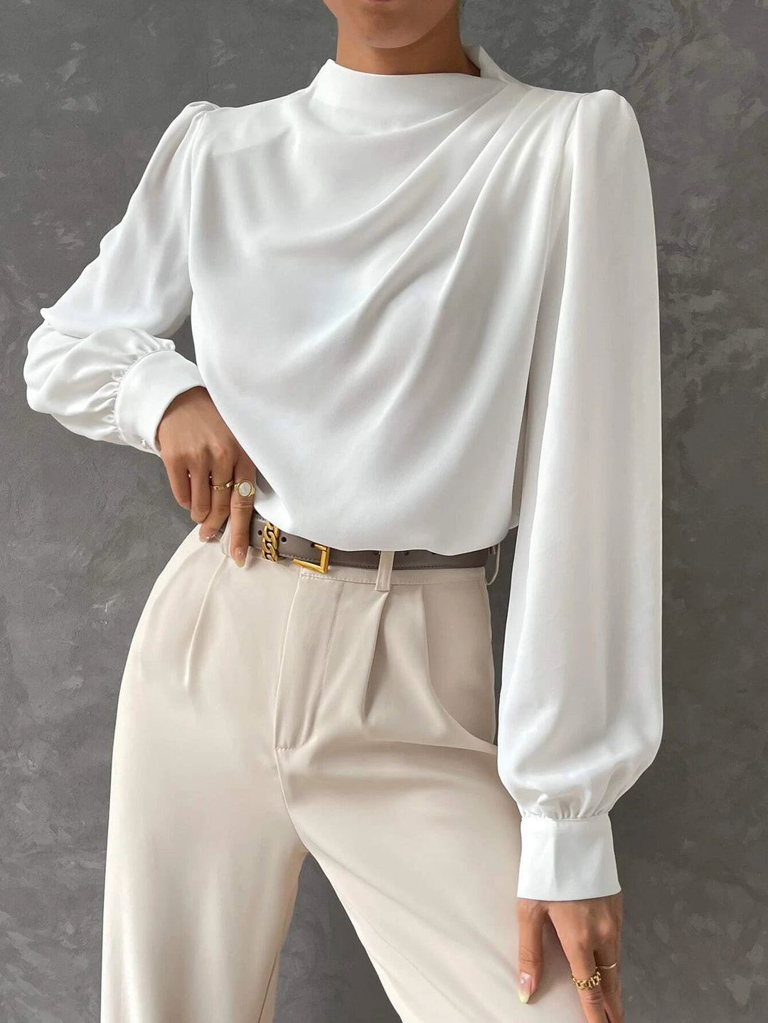 Flowy women's bishop sleeve blouse, draped neckline. Elegant long sleeve top for versatile sophisticated style.