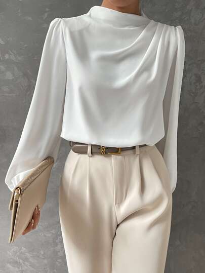 Stunning women's bishop sleeve blouse for evening wear. Chic long sleeve top with elegant draped neckline.