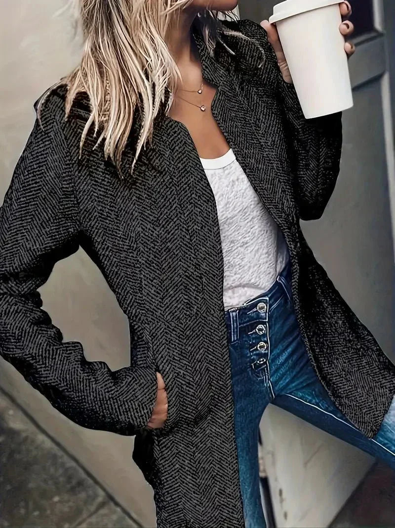 Stylish long sleeve women's herringbone coat. Tailored design with an open front, offering an elegant fall fashion statement.