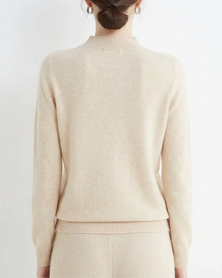 Elegant women's mock neck knit sweater, a comfortable long sleeve pullover for versatile styling.