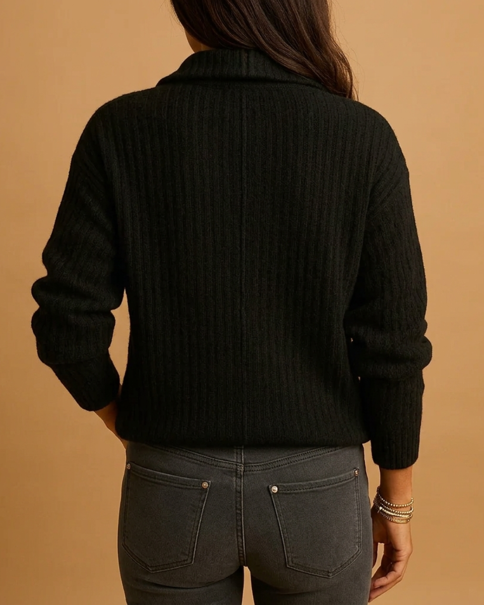 Flat lay of a women's half-zip structured sweater, emphasizing its polished design and versatile appeal.