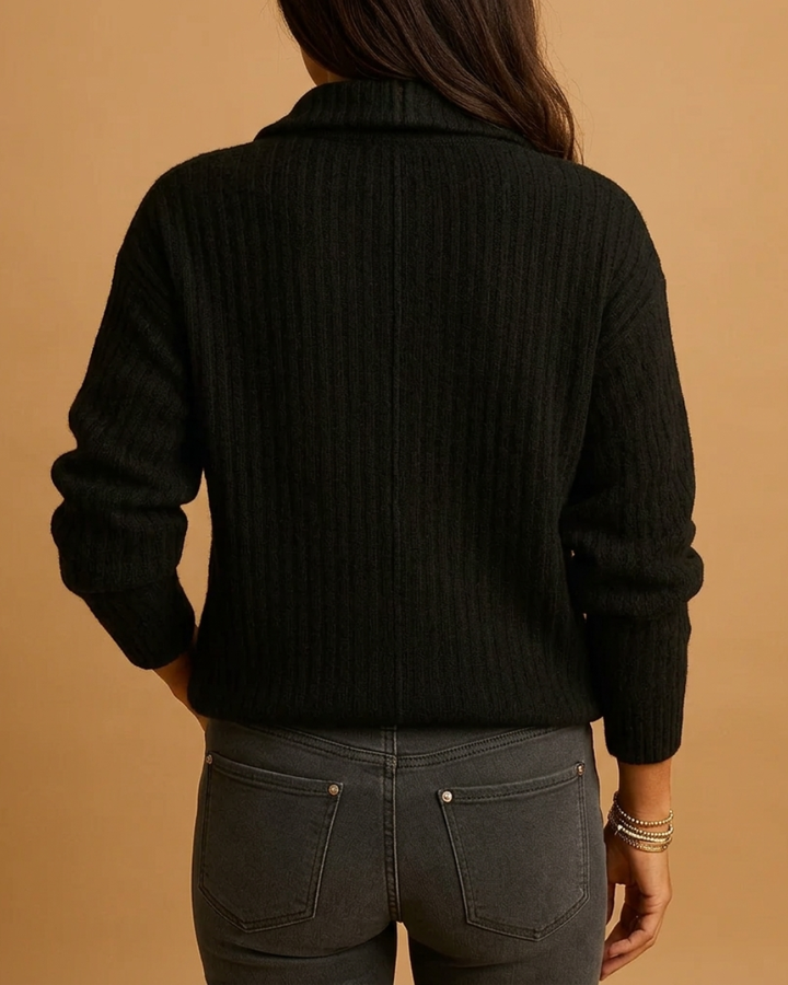 Flat lay of a women's half-zip structured sweater, emphasizing its polished design and versatile appeal.