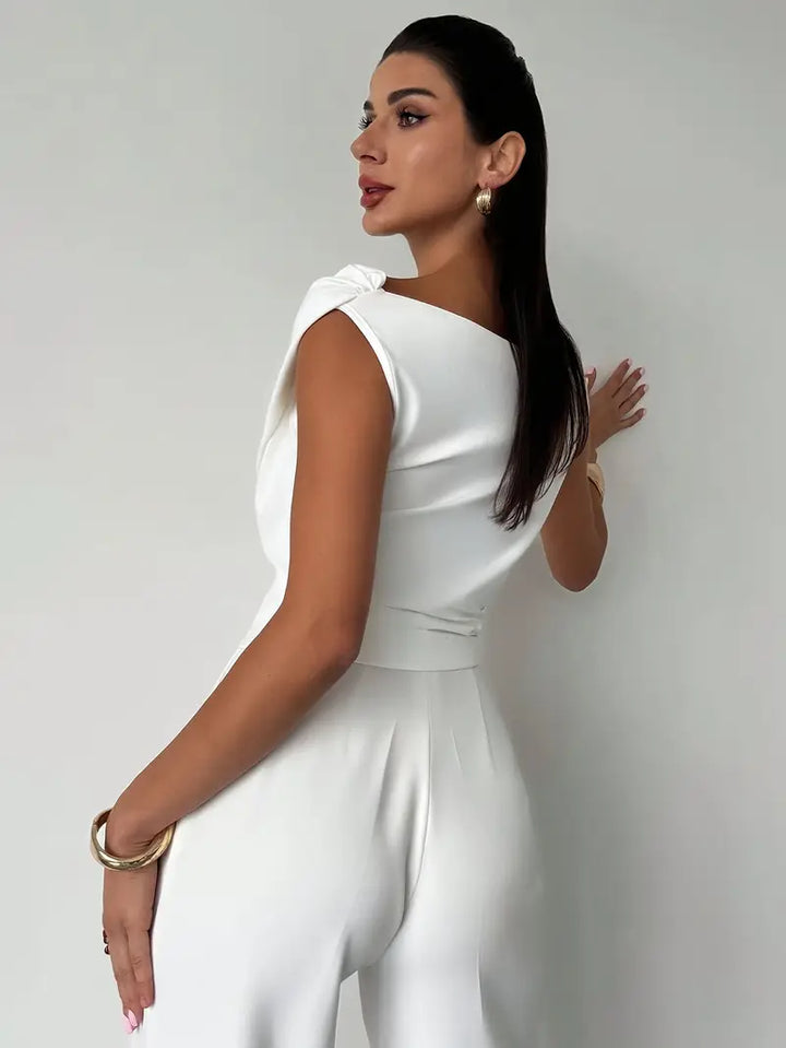 Sleeveless overlap neck blouse, a versatile women's top for elegant office or casual look.