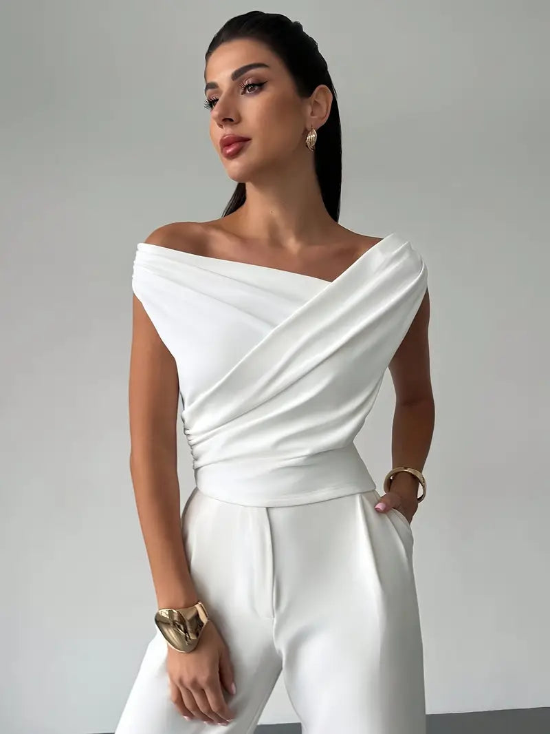 Women's elegant sleeveless blouse with overlap neck. Perfect for office or casual wear.