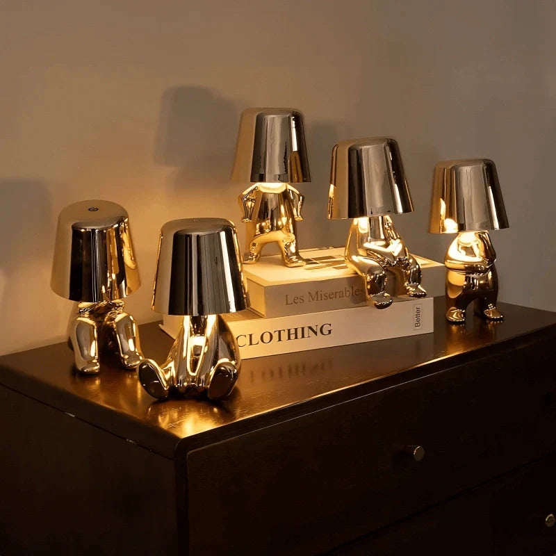 Rechargeable LED figurine lamp with touch control, offering dimmable & portable ambient light.