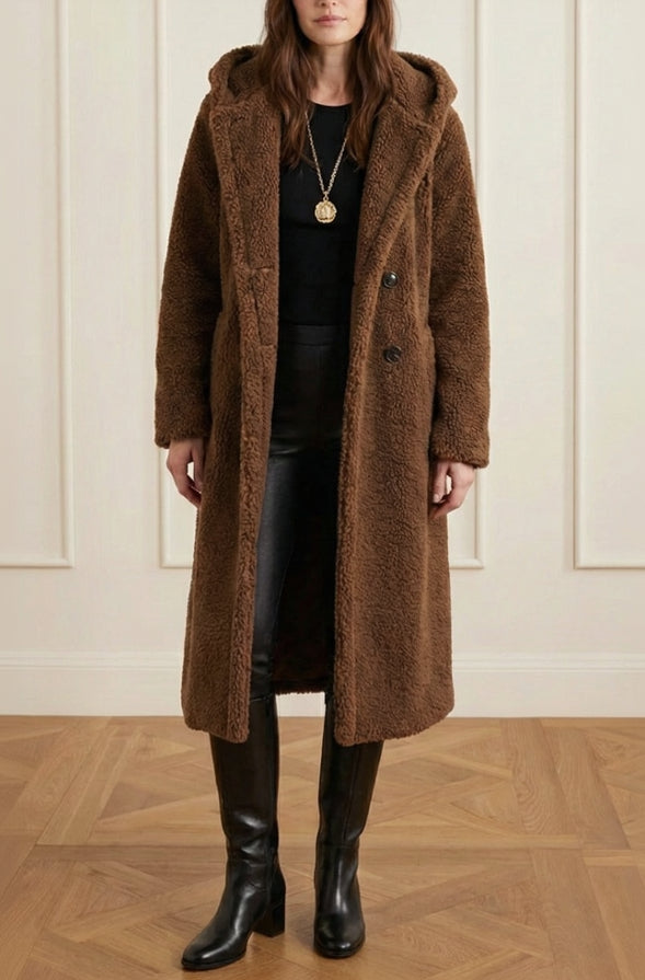 Women's oversized faux fur teddy long coat. Cozy, chic winter outerwear with button closure.