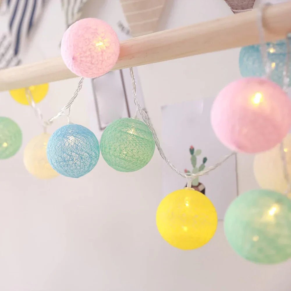 Nvroome Lights warm LED cotton ball string lights creating a romantic atmosphere.