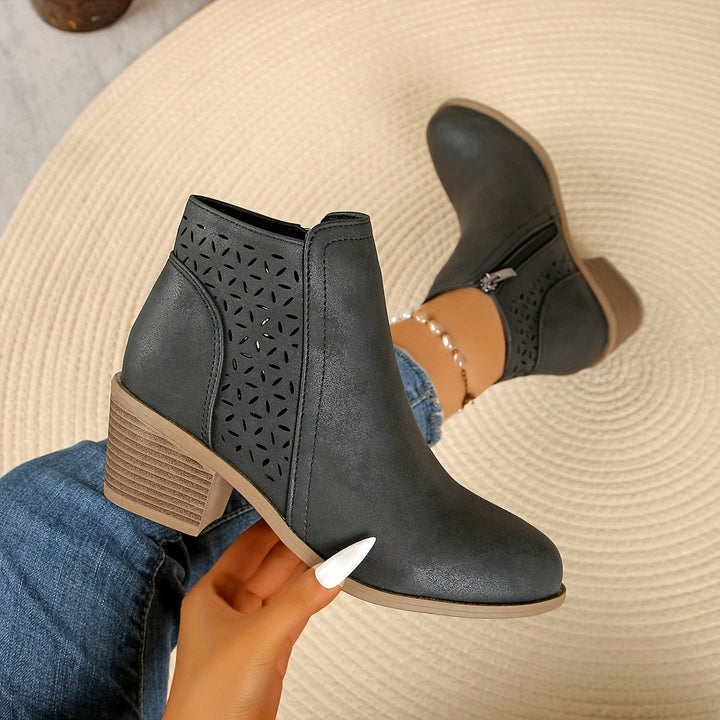 Stylish and comfortable women's orthopedic boots, laser-cut ventilated for all-day wear.