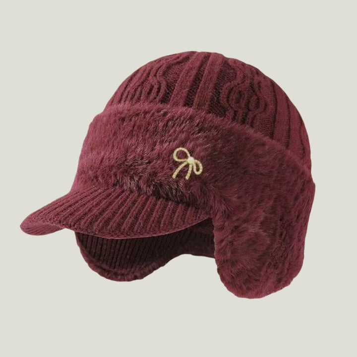 Protective trapper hat, unisex, with flexible ear flaps and visor, ideal for snowy and windy conditions.