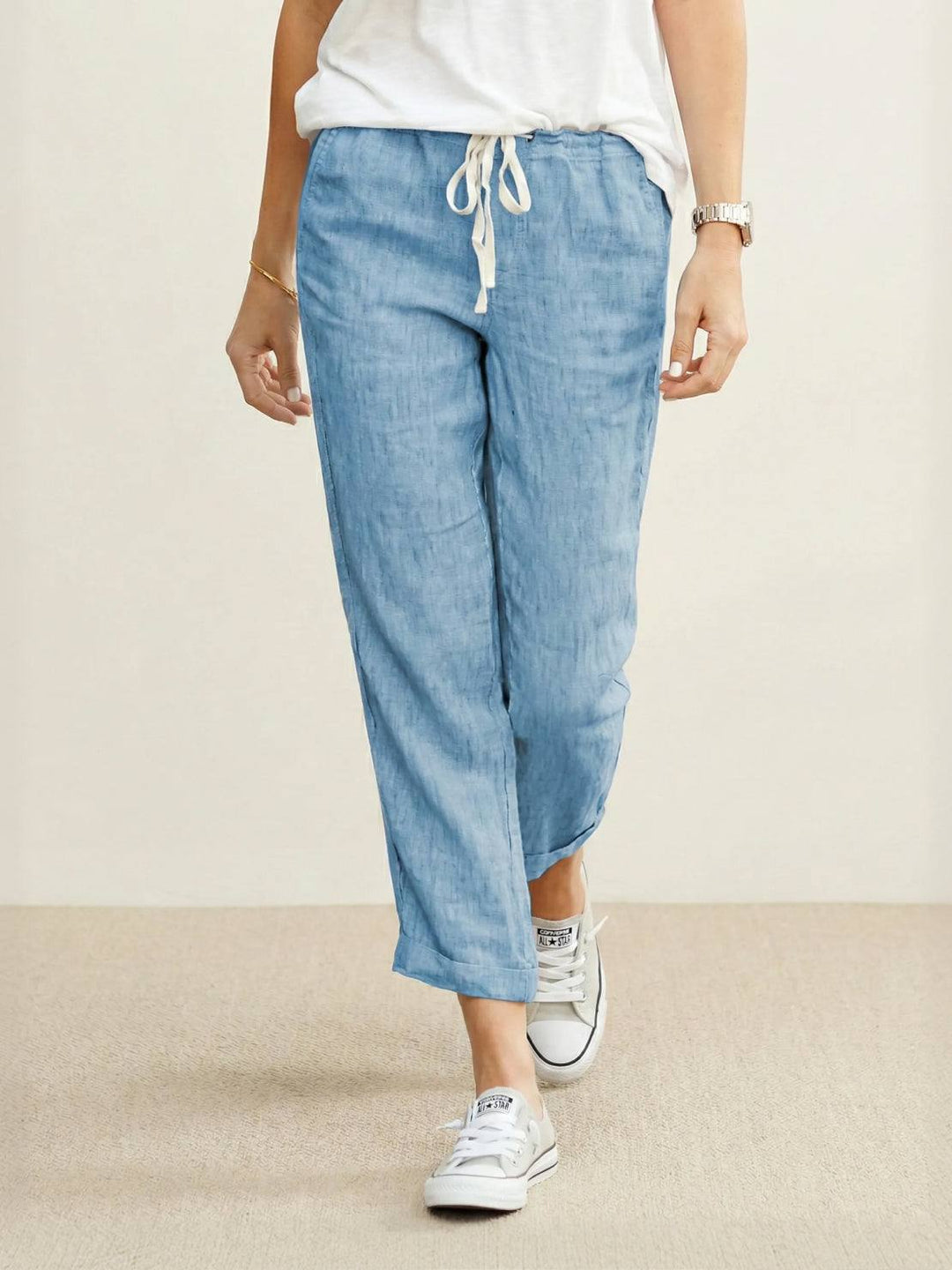Relaxed women's wide leg lounge pants with elastic drawstring waist, great for comfort and daily wear.