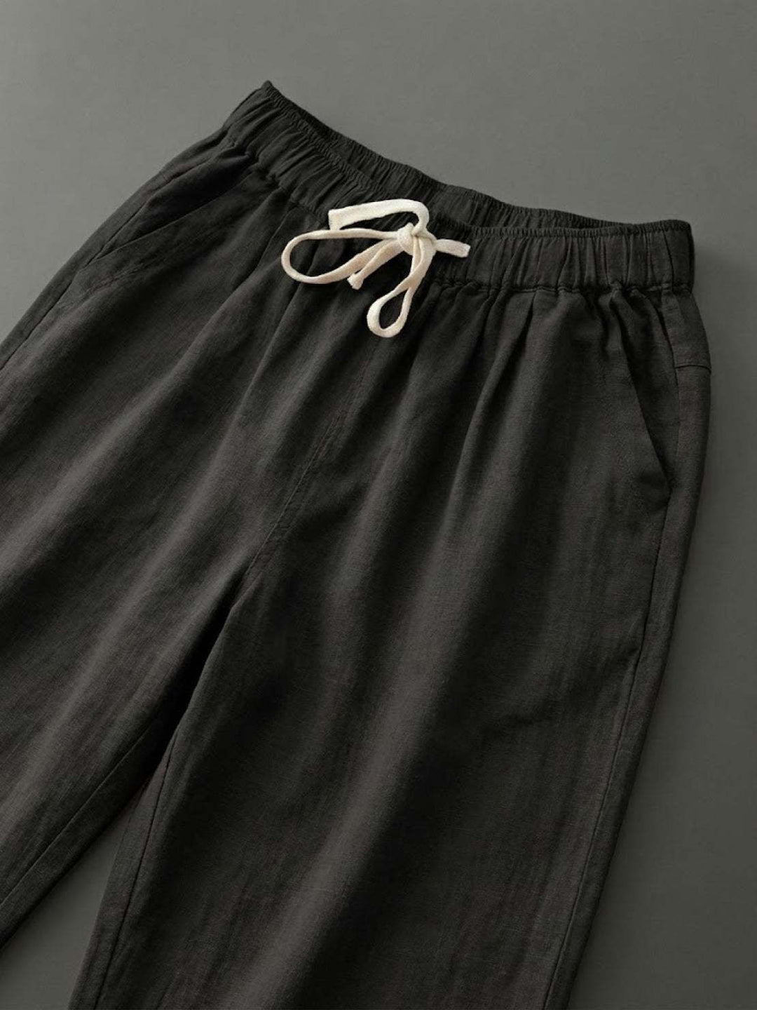 Model in comfortable women's wide leg drawstring pants, showcasing a chic, relaxed casual look.