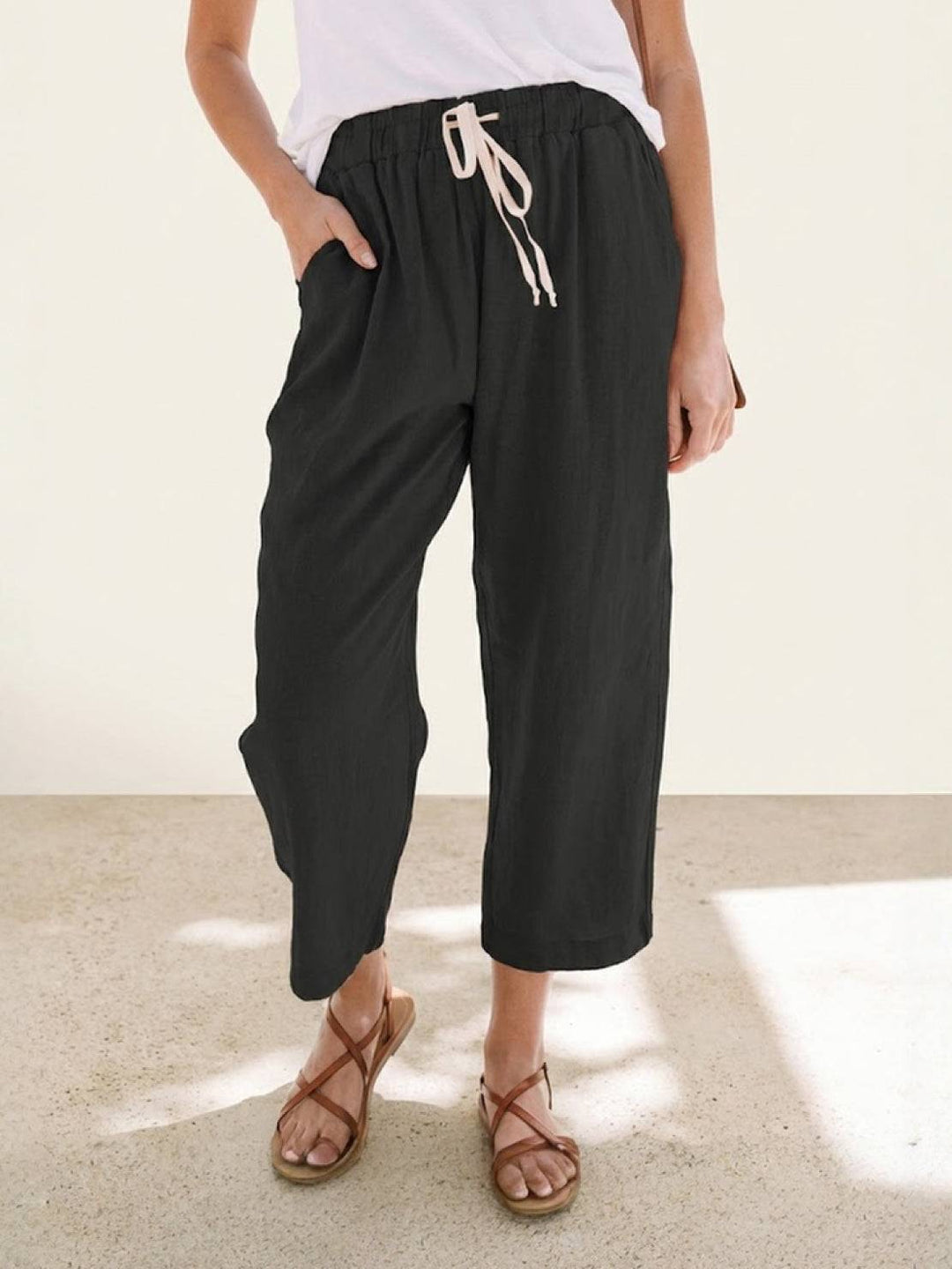 Close-up of the fabric texture and drawstring on women's relaxed fit wide leg casual pants.
