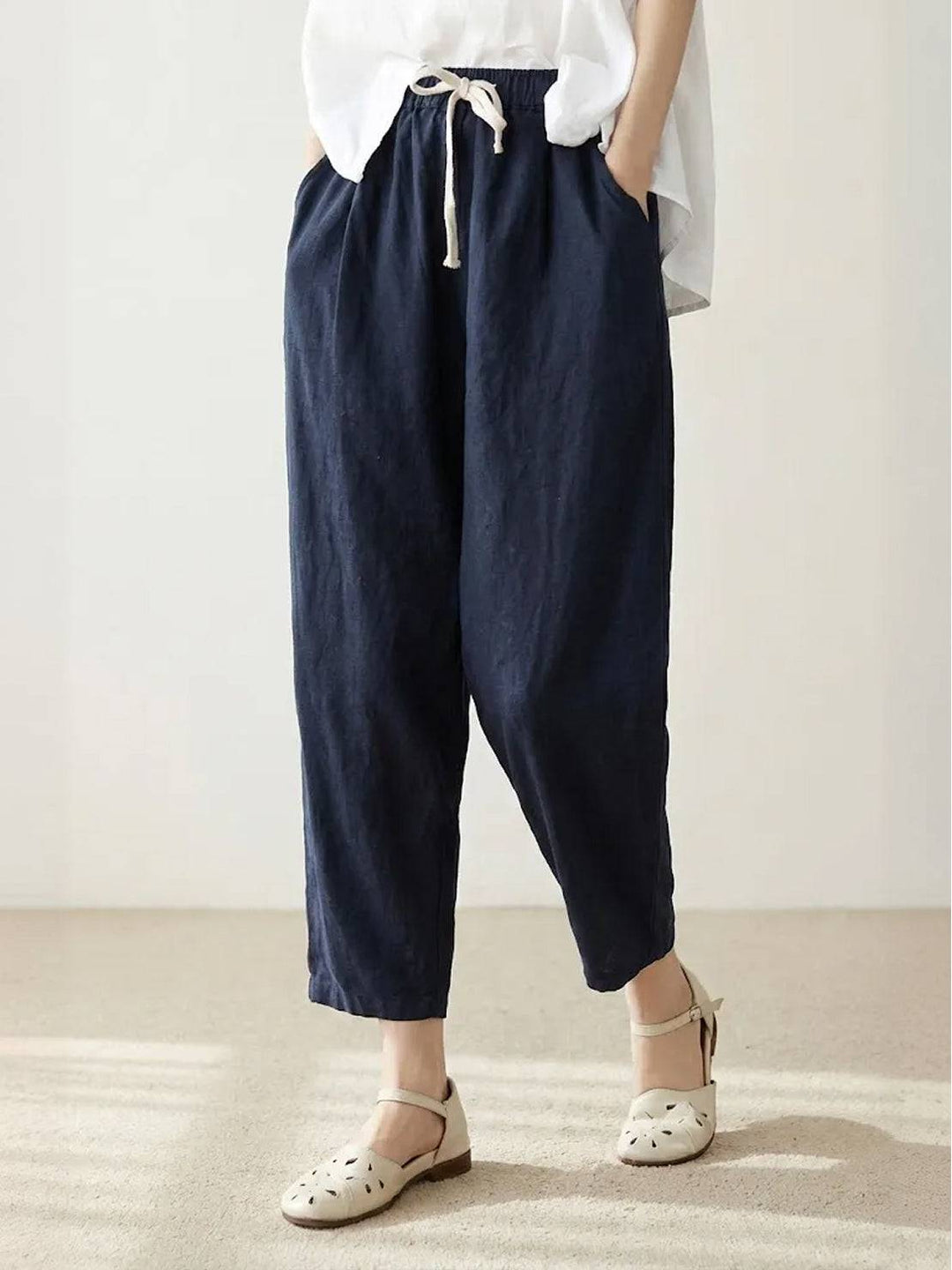 Women's wide leg drawstring pants paired with a top, ideal for a versatile everyday casual outfit.
