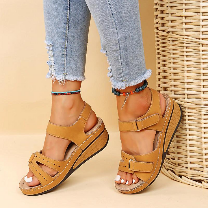 Close-up of women's orthopedic sandals, highlighting contoured arch support & pain-relieving footbed.