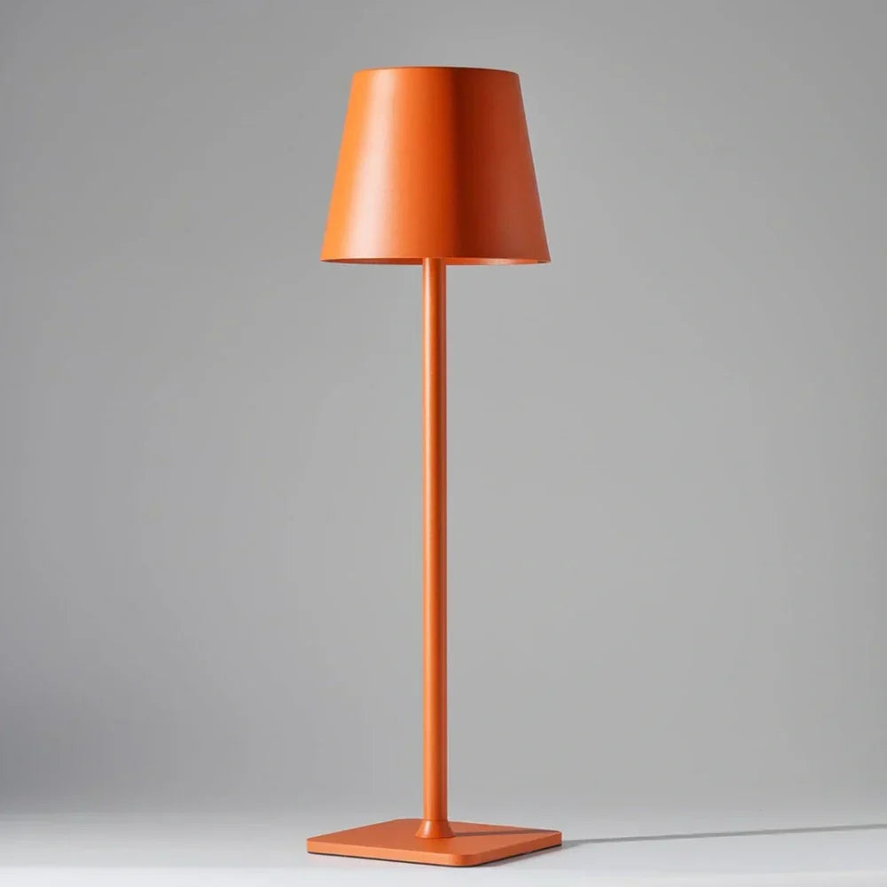Ambiance-creating LED table lamp, modern & dimmable. Rechargeable for indoor/outdoor versatility.