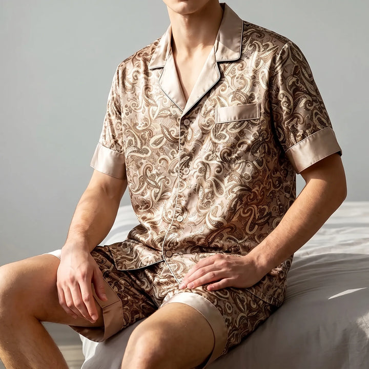 Men's relaxed fit patterned summer pajamas set with short sleeves & shorts, ideal comfortable nightwear.