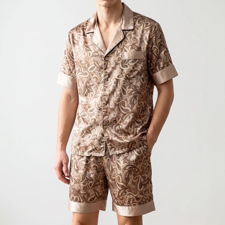 Comfortable men's patterned loungewear set with paisley shorts and short-sleeve top for summer sleepwear.