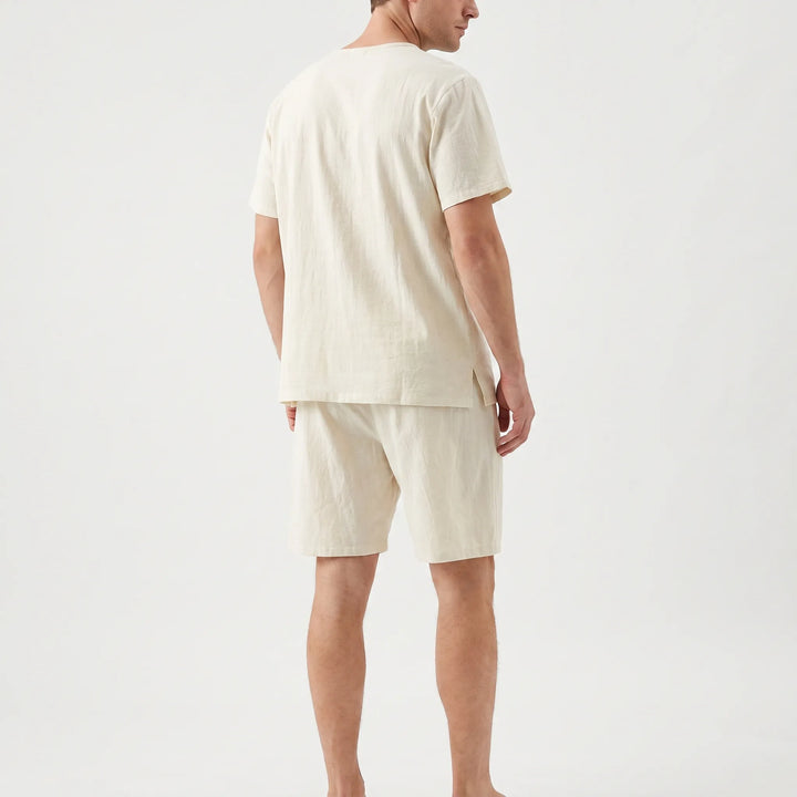 Breathable men's short sleeve pajama set, perfect for comfortable warm night sleep and loungewear.