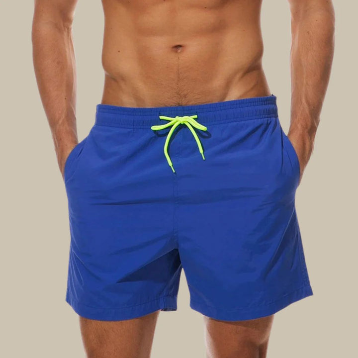 Comfortable men's quick-dry drawstring swim shorts for beach vacation, swimming, or active summer days. Stylish & practical.