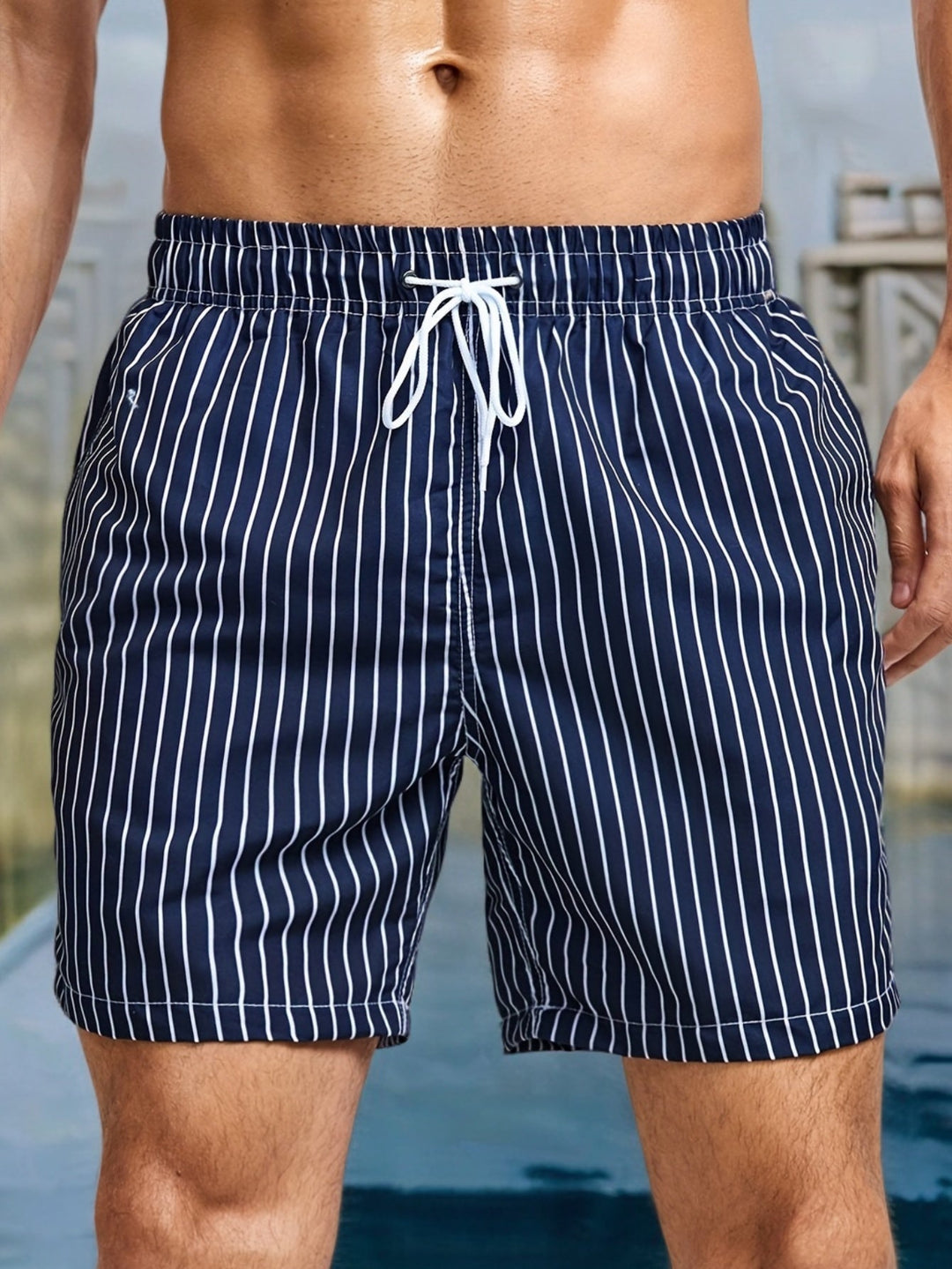 Men's striped swim shorts with drawstring, quick-dry fabric, ideal for beach and casual summer wear.