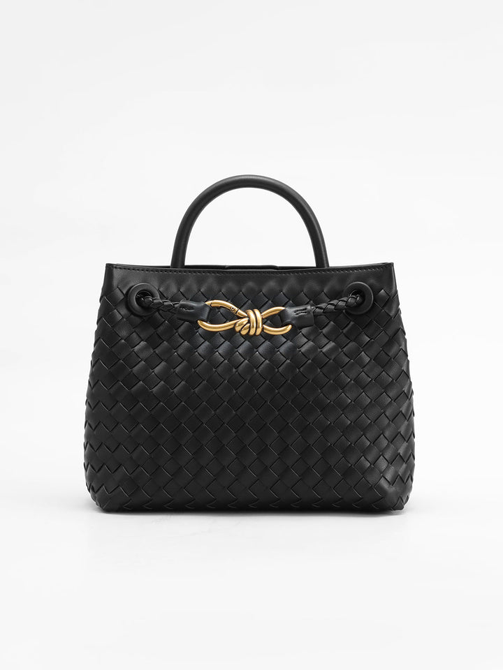 Stylish women's woven top handle bag with elegant twist accent. Chic fashion accessory for daily use.