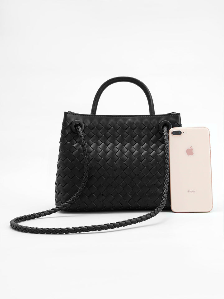 Chic women's woven top handle bag, perfect as a stylish daily handbag. Features an elegant twist design.