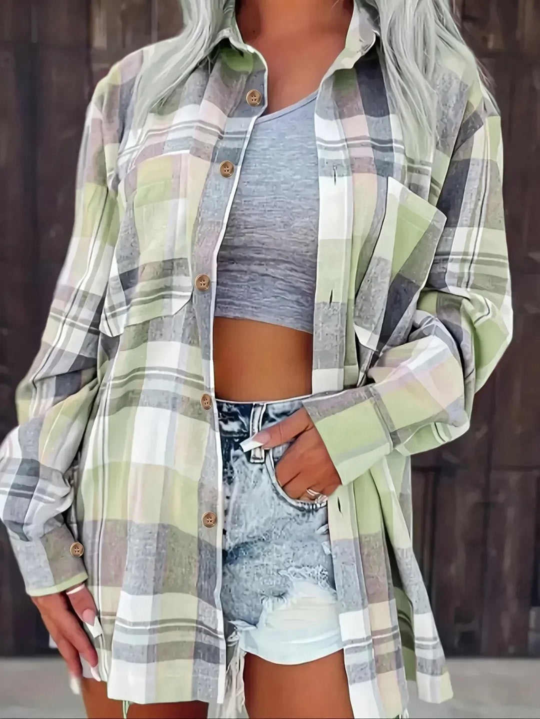 Stylish women's oversized plaid button-down shirt, a comfy, relaxed fit top for any casual outfit.