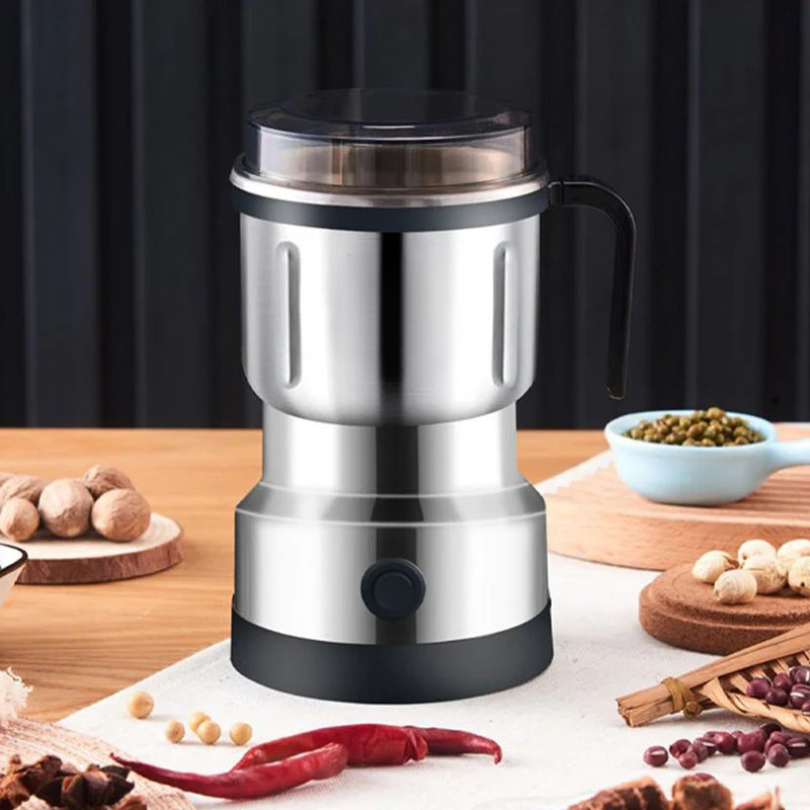 Portable mini electric spice and coffee grinder, ideal for quick grinding of fresh ingredients and home use.