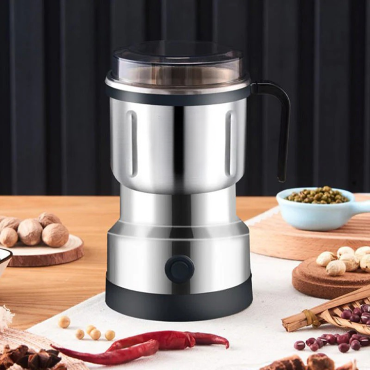 Portable mini electric spice and coffee grinder, ideal for quick grinding of fresh ingredients and home use.