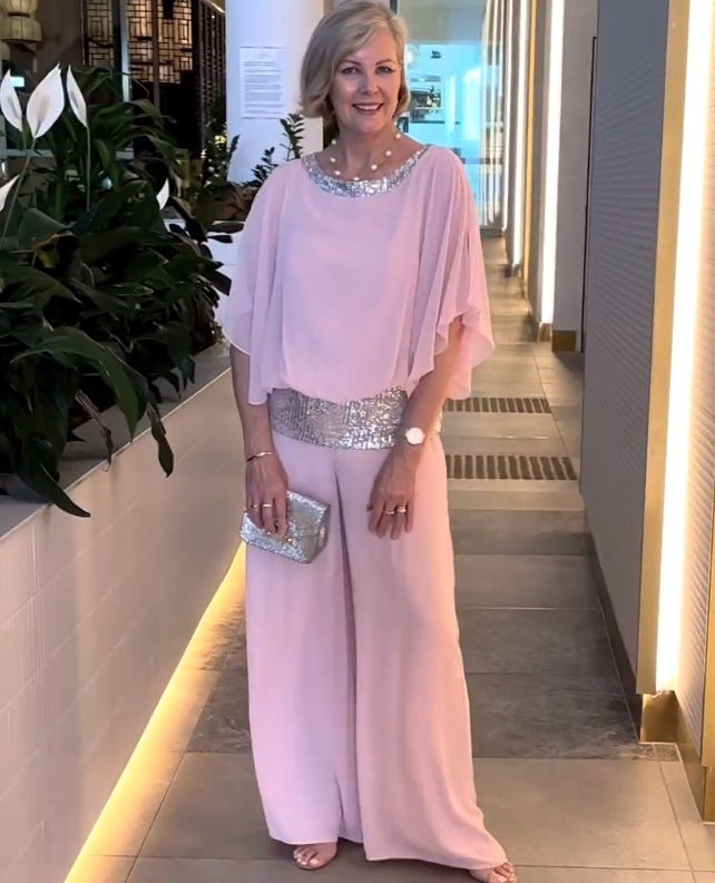 Elegant women's two-piece evening set with a sparkly top and wide-leg pants. Perfect formal attire for special occasions.