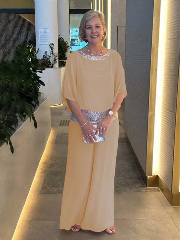 Elegant women's two-piece set: a shimmering sparkly top paired with classy wide-leg formal pants for a complete ensemble.
