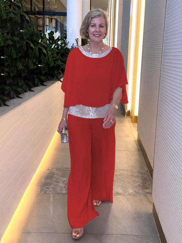 Classy women's two-piece evening ensemble, featuring a sparkly top & elegant wide-leg pants for a sophisticated party look.
