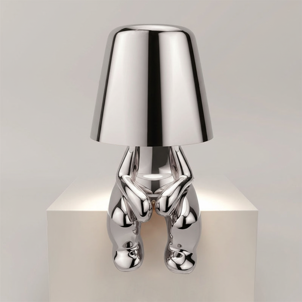 Minimalist modern cordless table lamp, dimmable, sculptural metal design for sophisticated lighting.