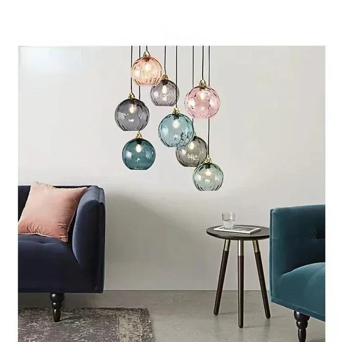 Vibrant gold GleamBall modern orb pendant light, a colorful statement piece for contemporary home decor.