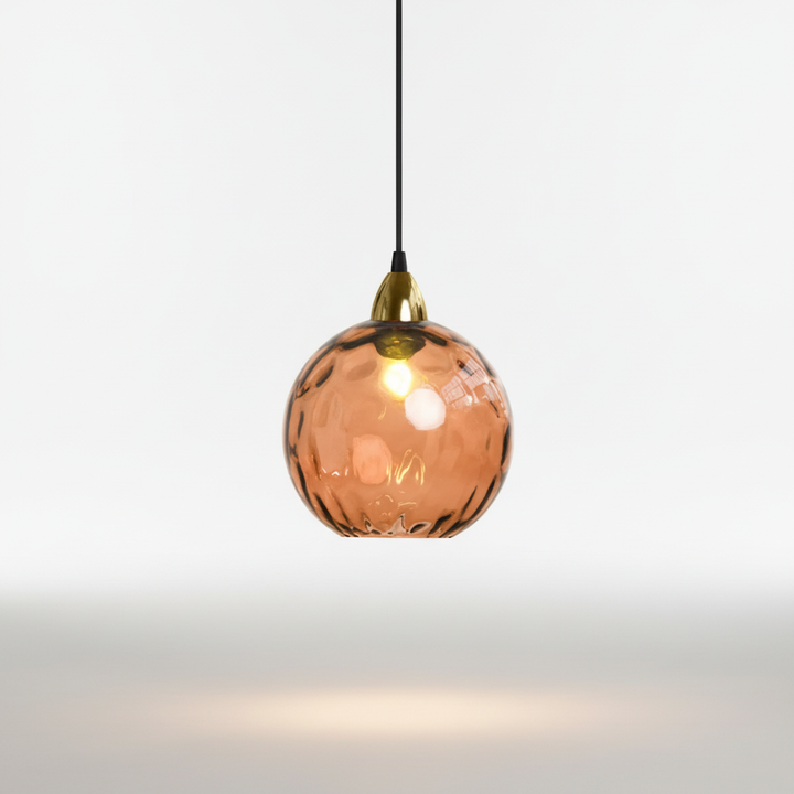 Modern GleamBall orb pendant lamp, providing ambient lighting for stylish living room interior design.