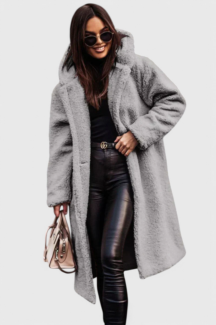 Women's long oversized faux fur teddy coat. Cozy, chic, and warm winter outerwear.