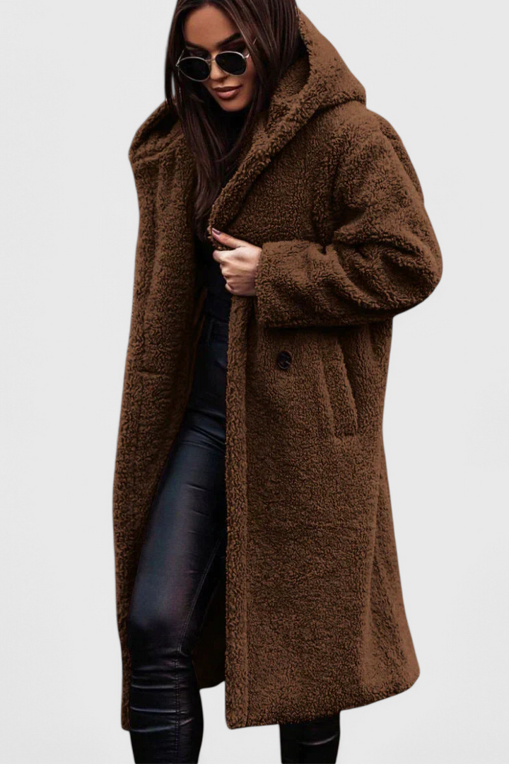 Stylish women's oversized faux fur teddy long coat. Warm, cozy outerwear for winter fashion.