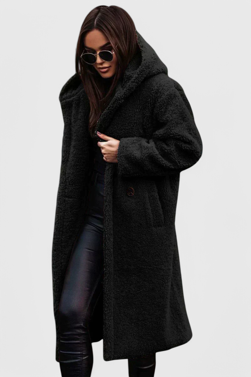 Cozy women's oversized faux fur long coat. Chic teddy outerwear with button closure for winter.
