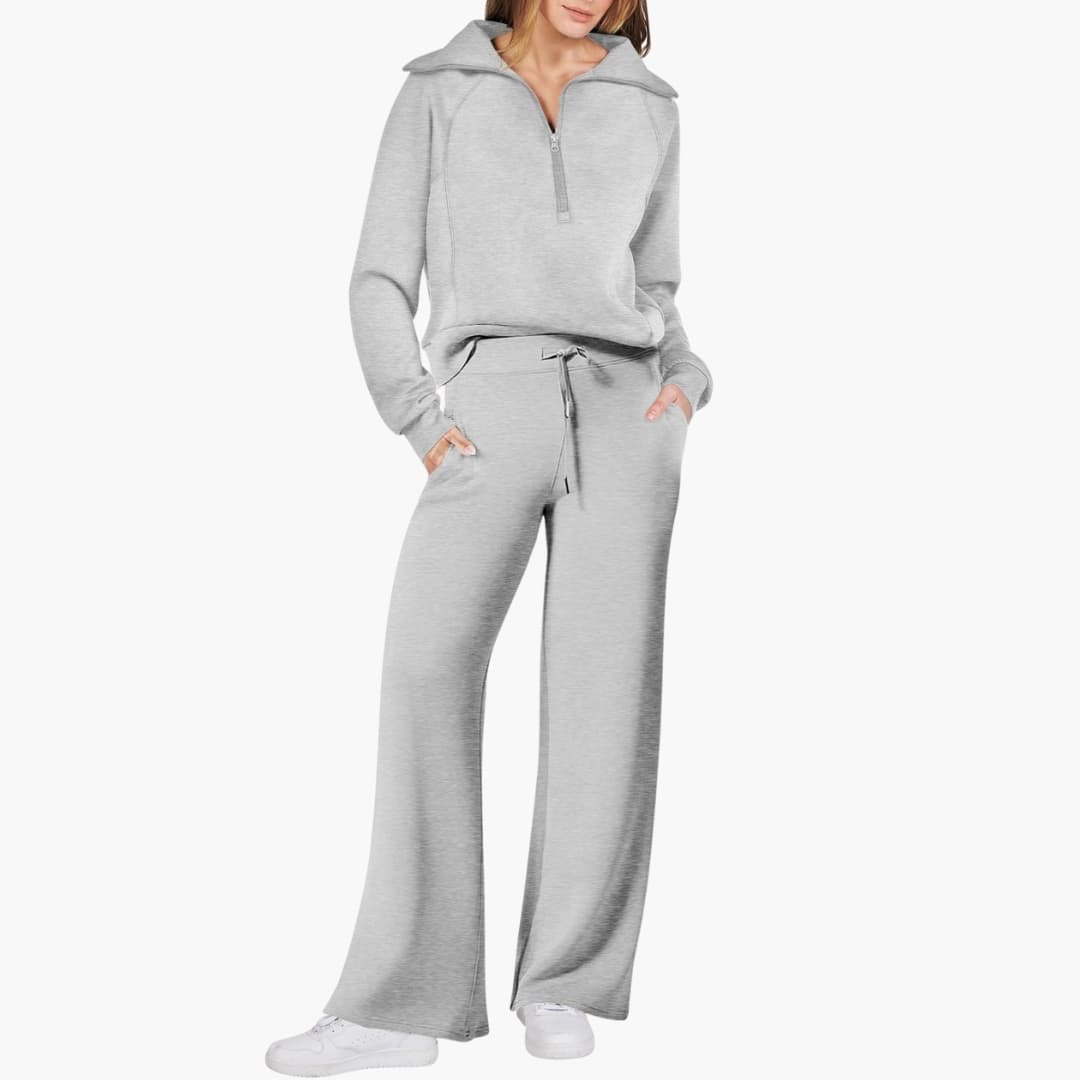 Women's half-zip lounge top & wide-leg pants. Elegant two-piece set for cozy fashion & athleisure travel.